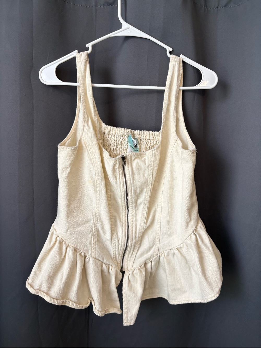 Future Collective Cream Zip-Front Peplum Top